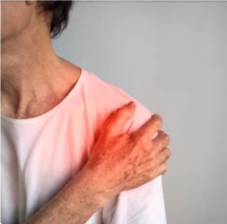 Man holding his right shoulder in pain — frozen shoulder and diabetes connection